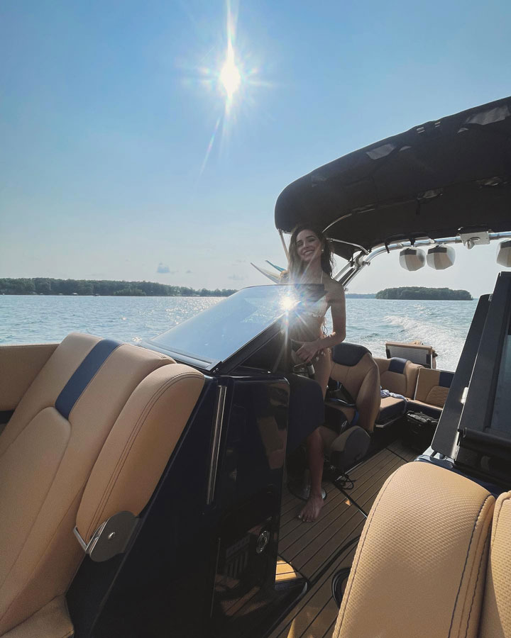 Olivia Culpo driving a boat Instagram