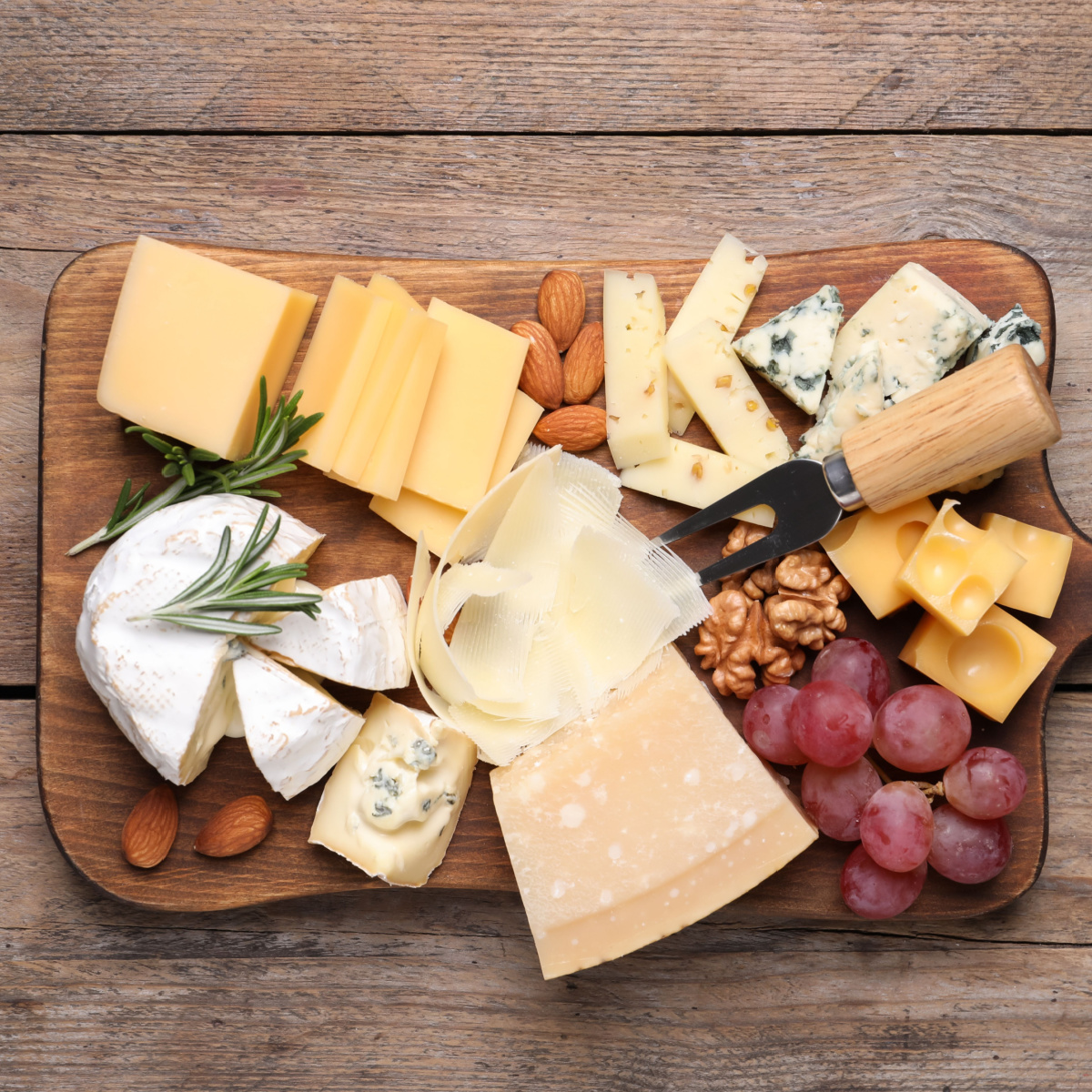 assorted cheese on a board