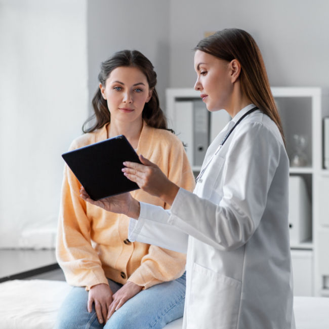 woman speaking to doctor