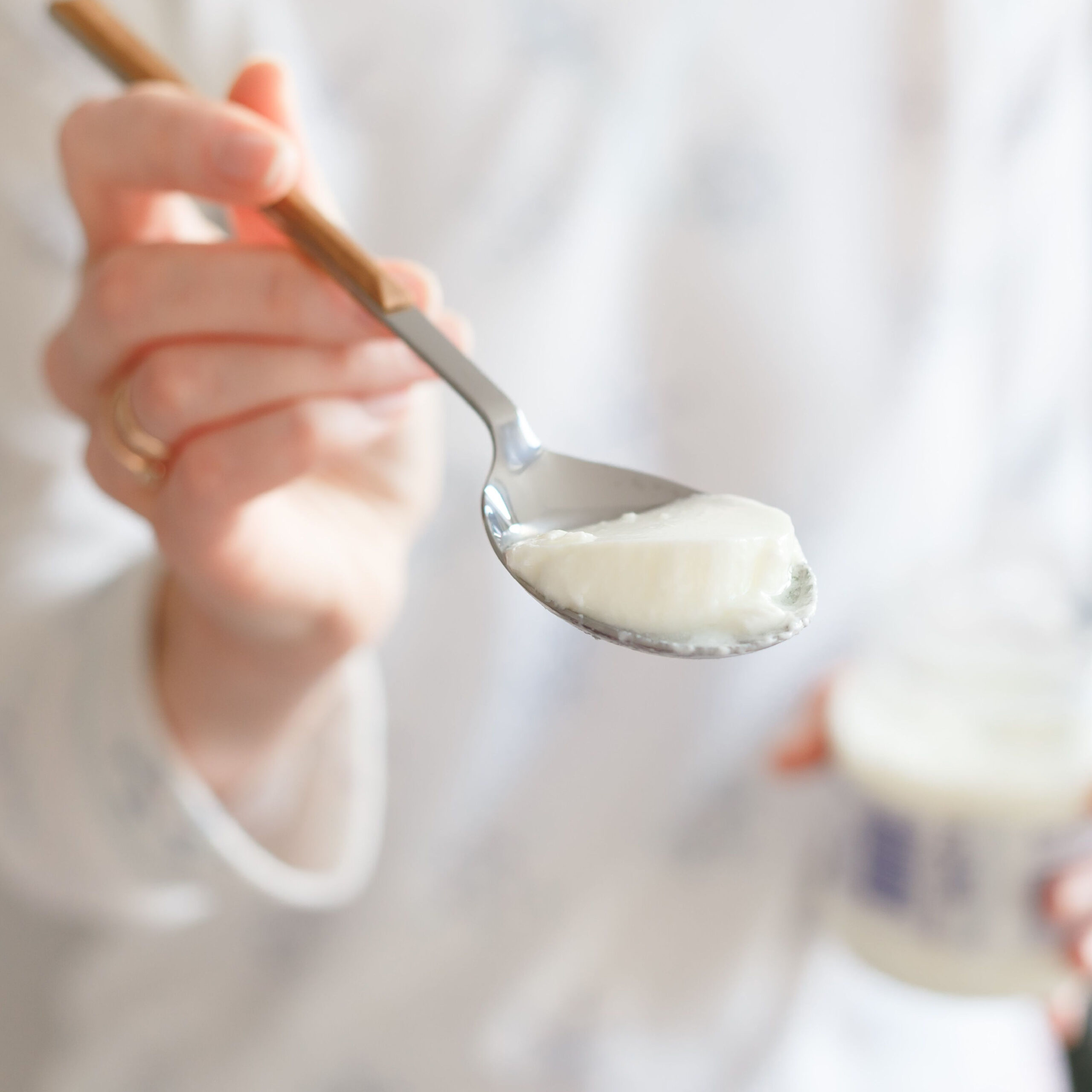 woman eating greek yogurt