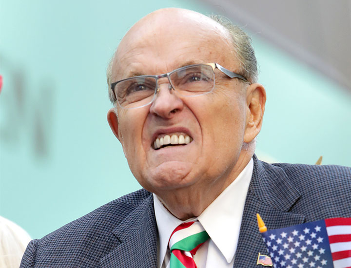 Rudy Giuliani rides a float during the 2022 Columbus Day Parade