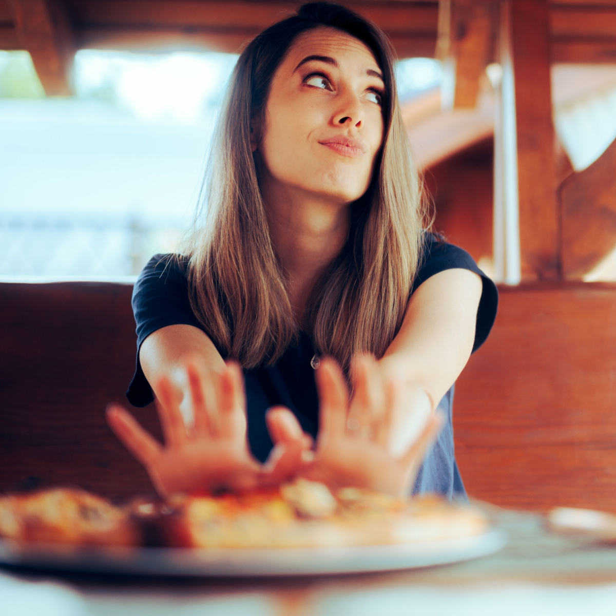 woman pushing food away