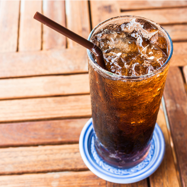 glass of cola with straw