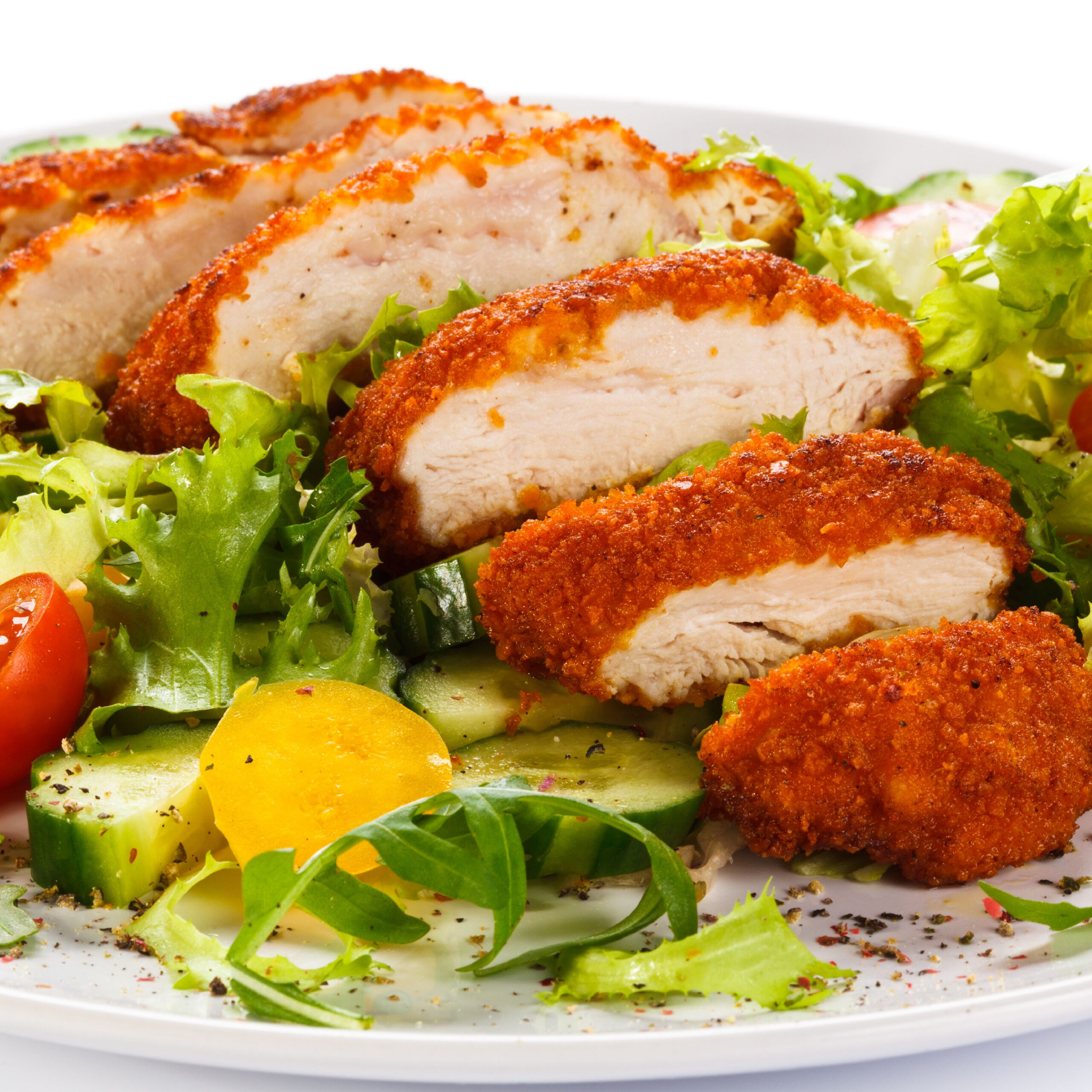 salad topped with fried chicken