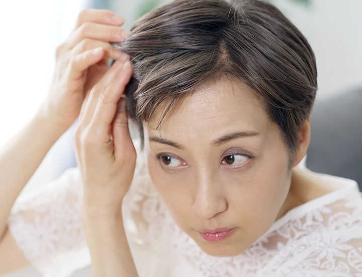 woman-checking-her-hair