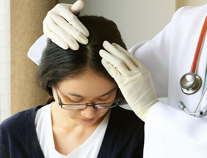 woman-getting-hair-scalp-checked