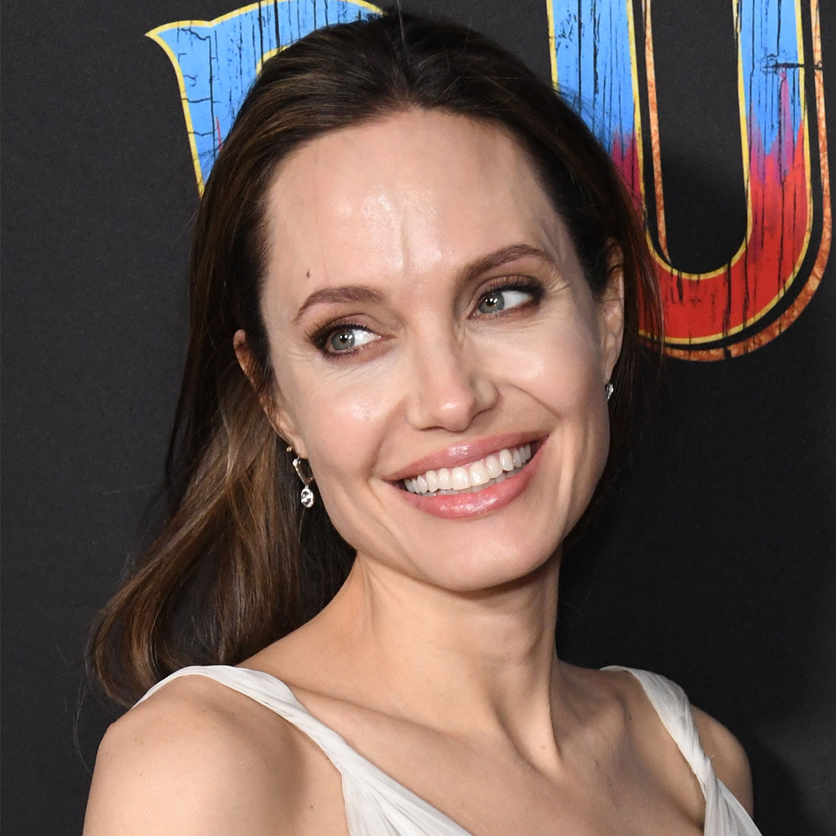 Angelina Jolie's Airport Attire Includes a Sleek Black Coat and a Massive  Tote