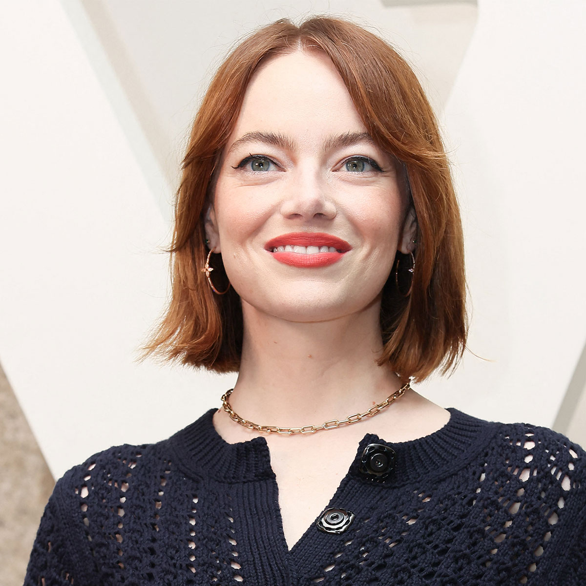 Emma Stone Shows Off Her Tiny Waist In Cinched, Elegant White