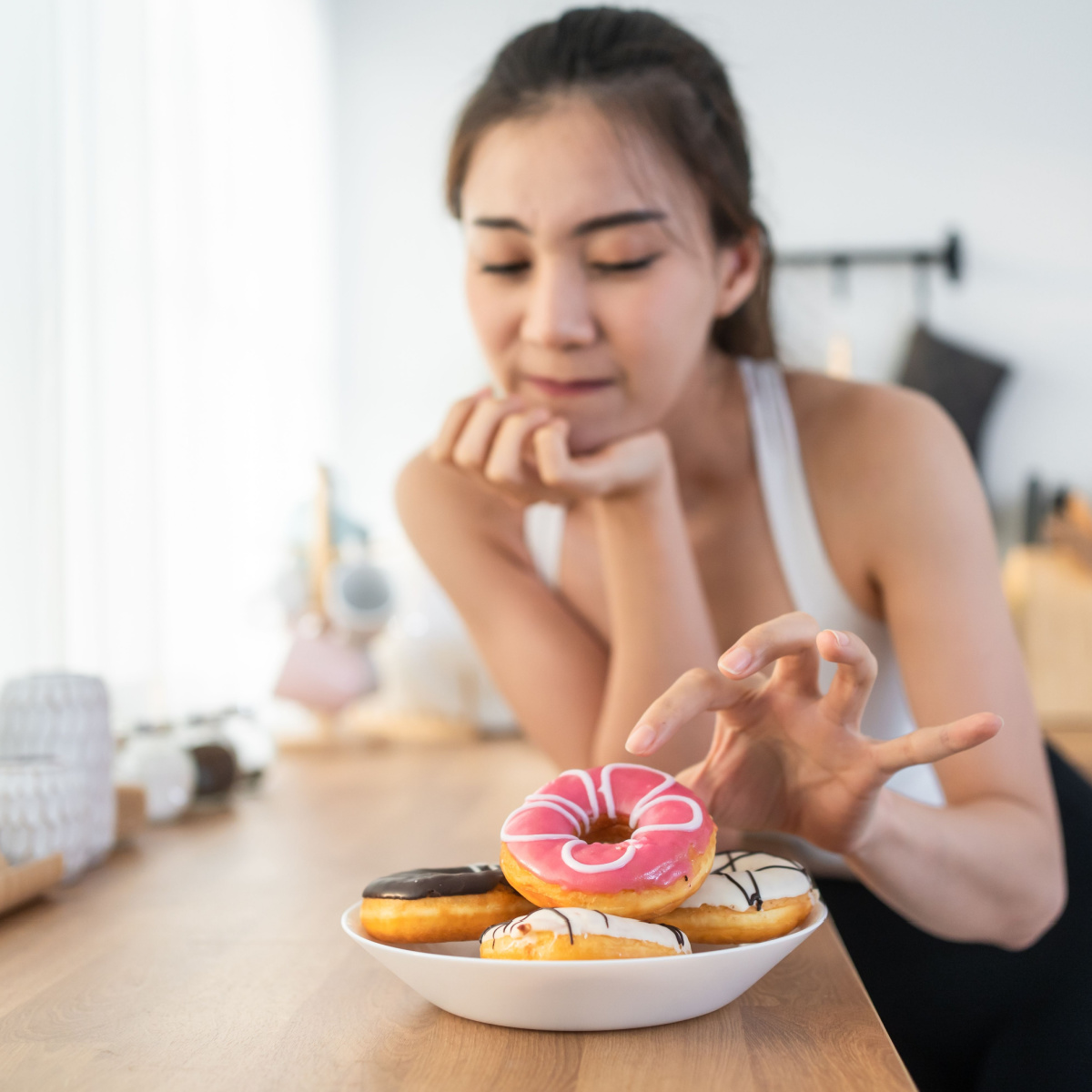 woman eating donuts