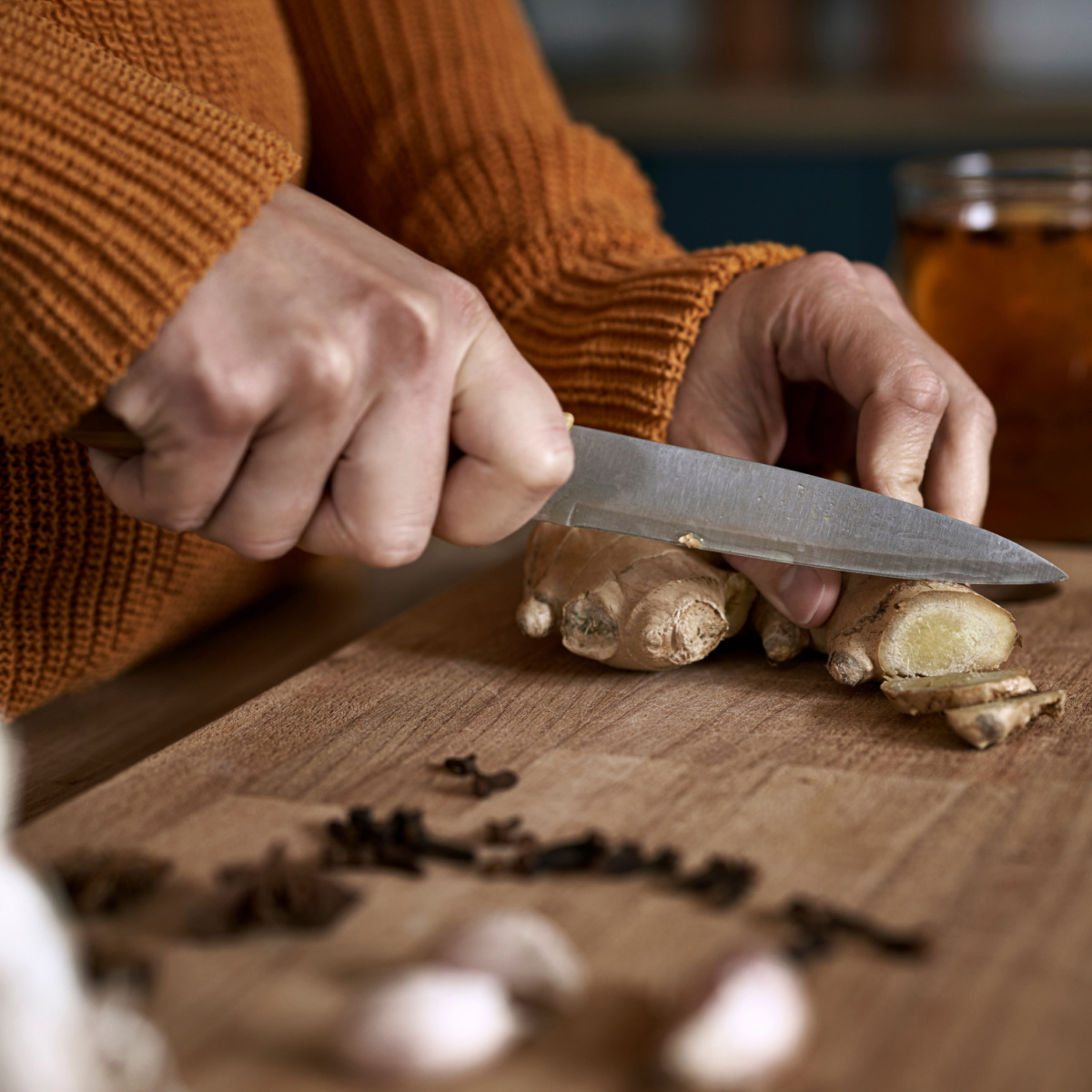 woman cutting ginger