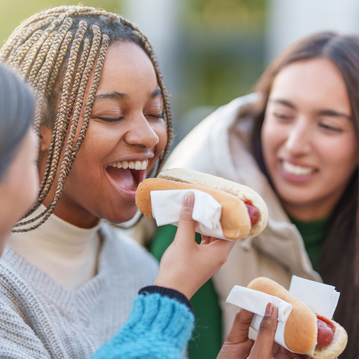 girls eating hot dogs