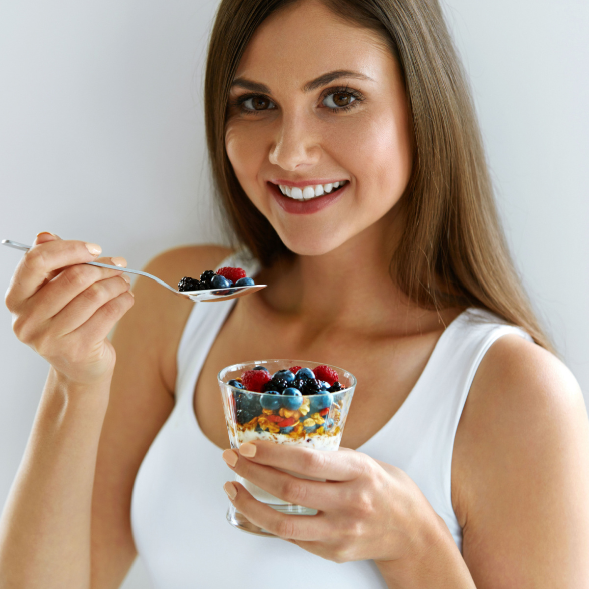 woman eating parfait