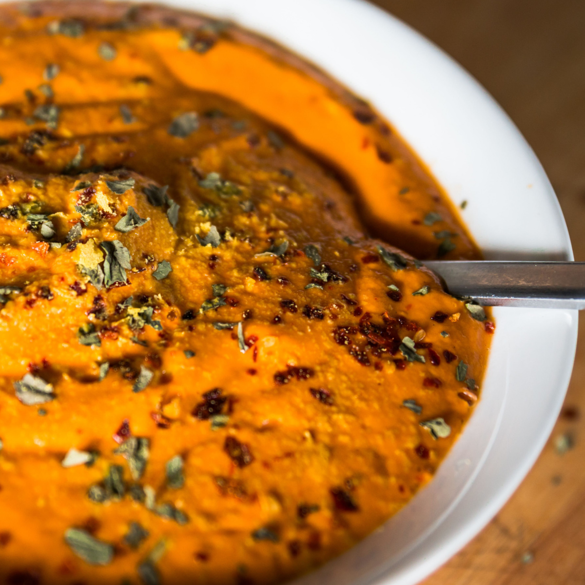 bowl of tomato soup with nutritional yeast