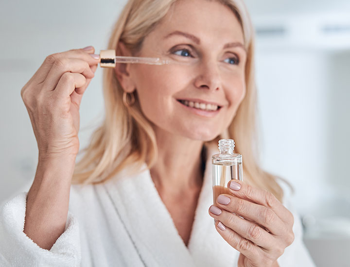 older-woman-holding-skincare