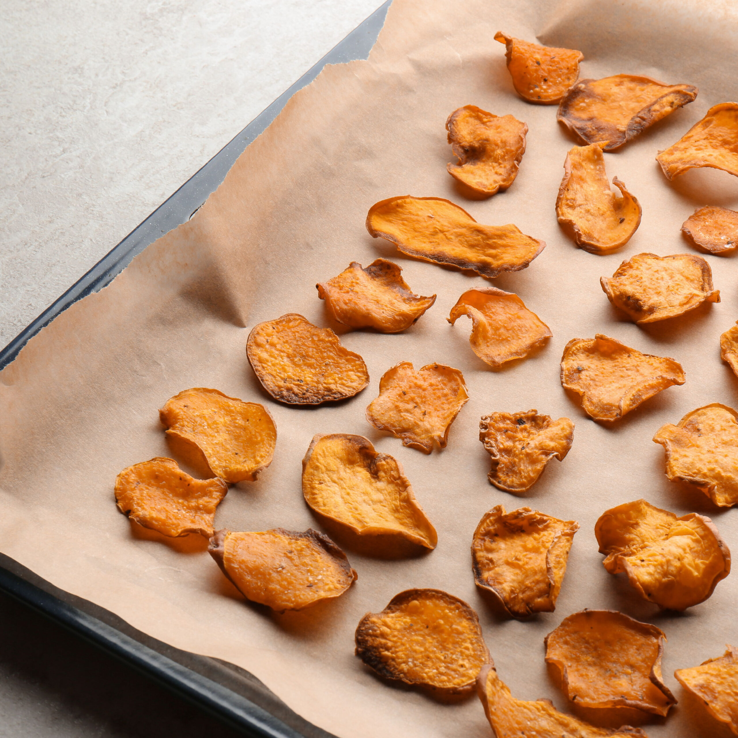 sweet potato chips on baking sheet