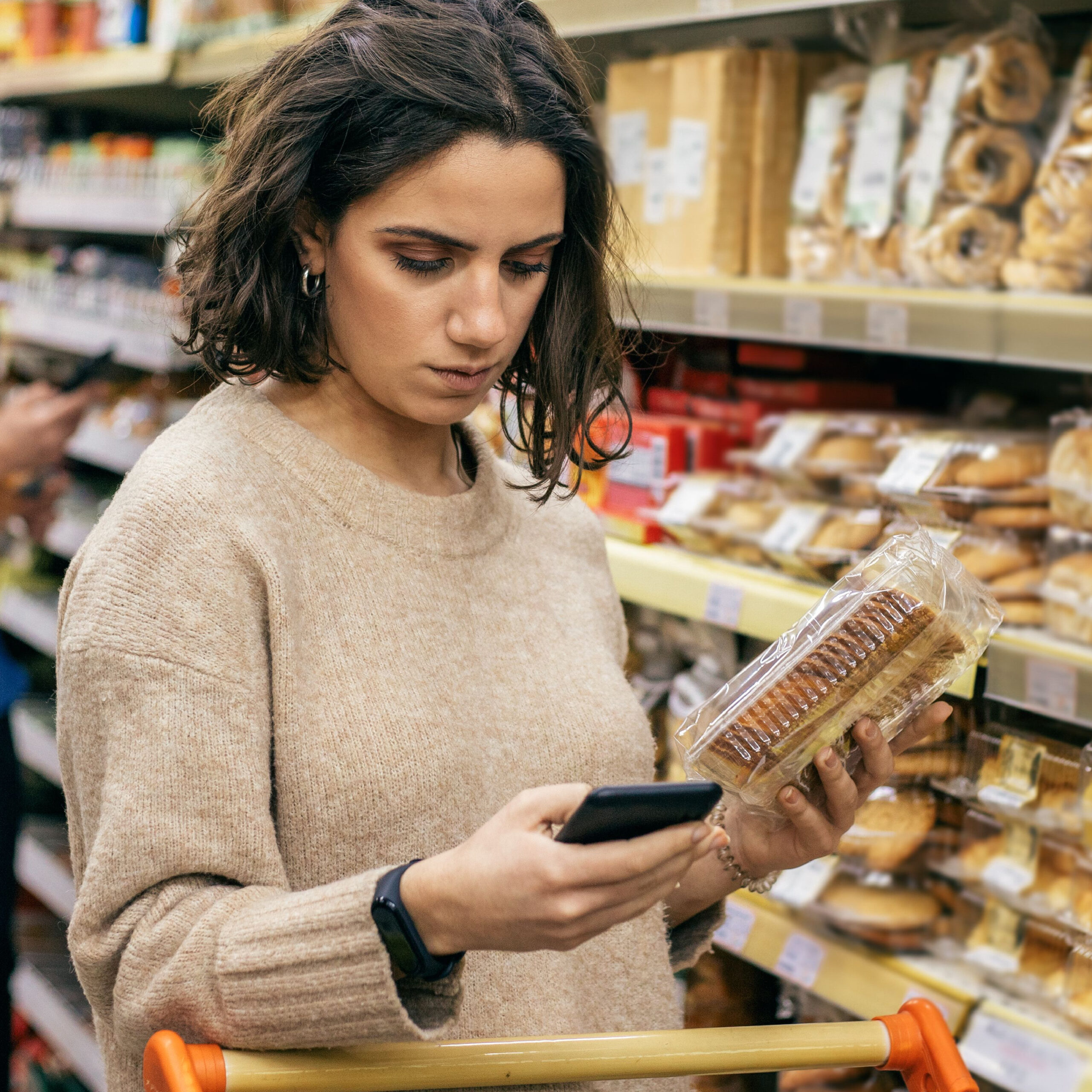 woman buying cookies at store