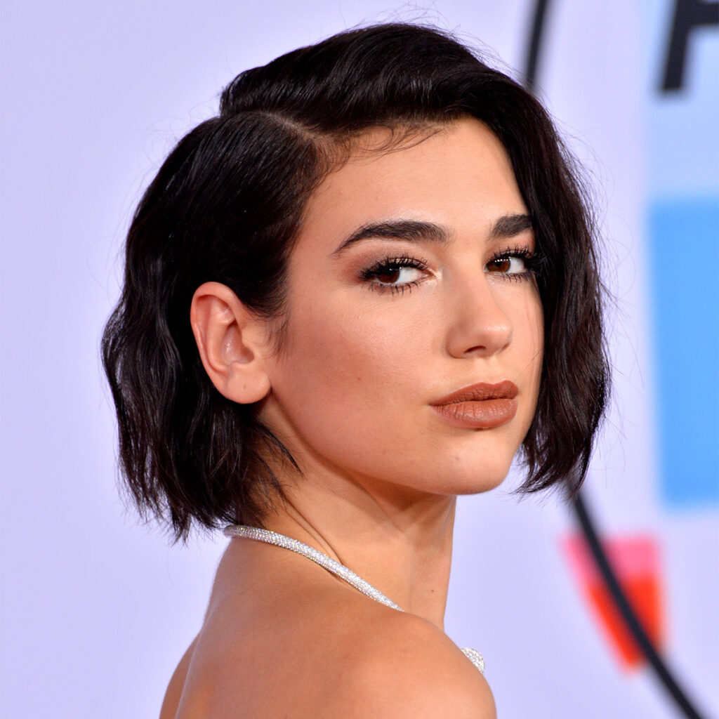 Dua Lipa Wears Black Leather Shirtdress at AFI Cocktail Reception