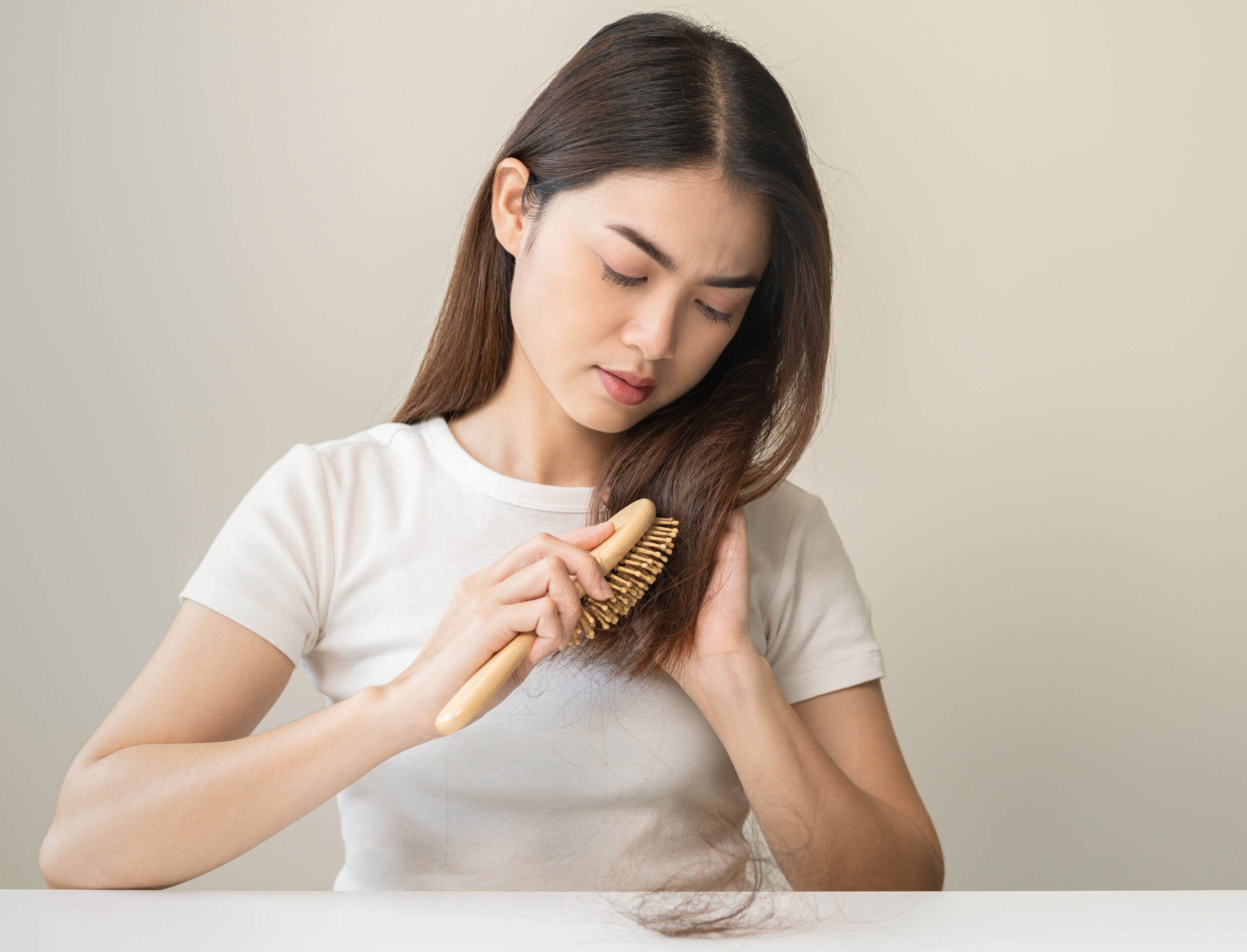 woman-brushing-damaged-hair