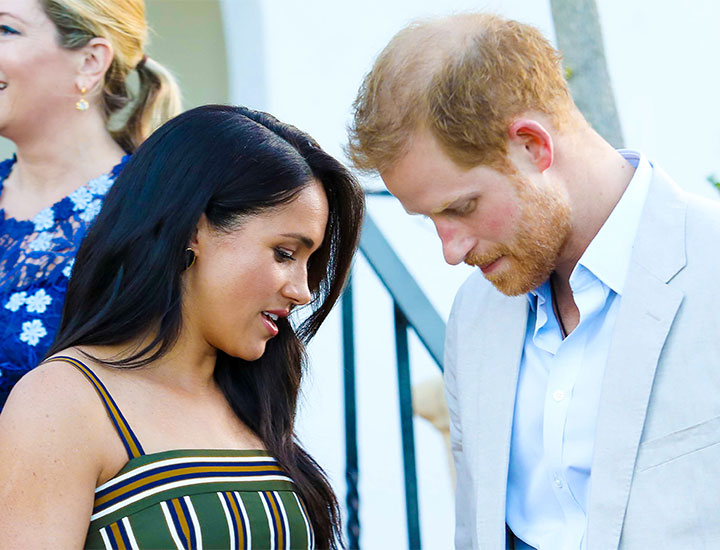 Prince Harry Meghan Markle looking solemn