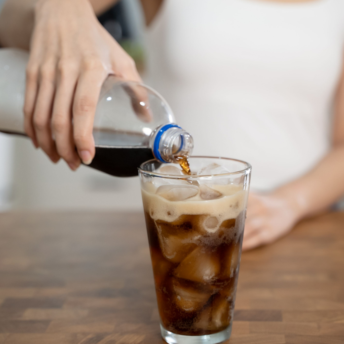 woman pouring soda