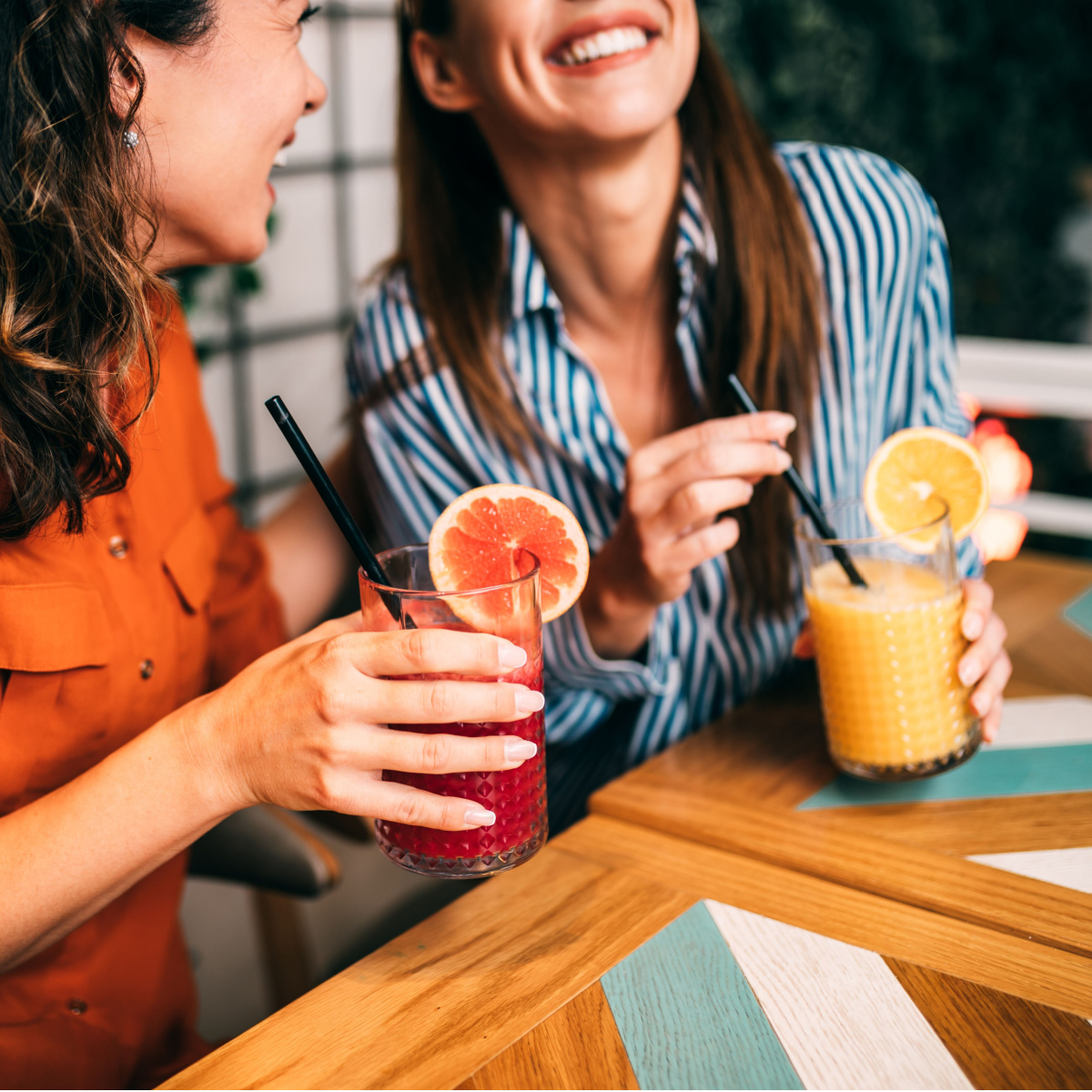 women drinking juice