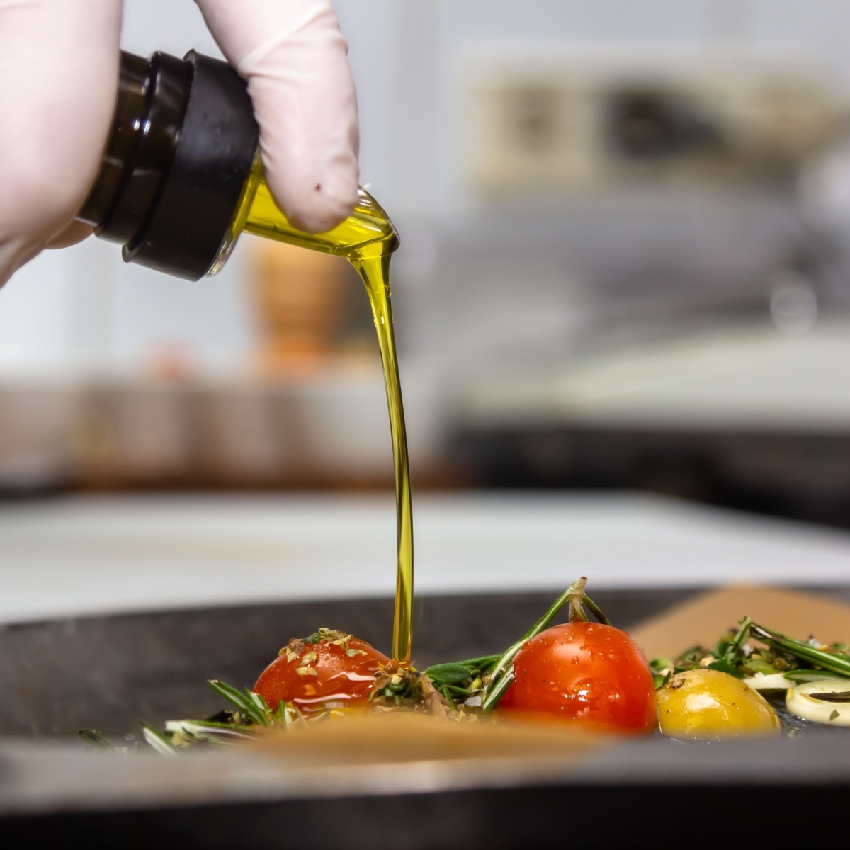 drizzling olive oil on food