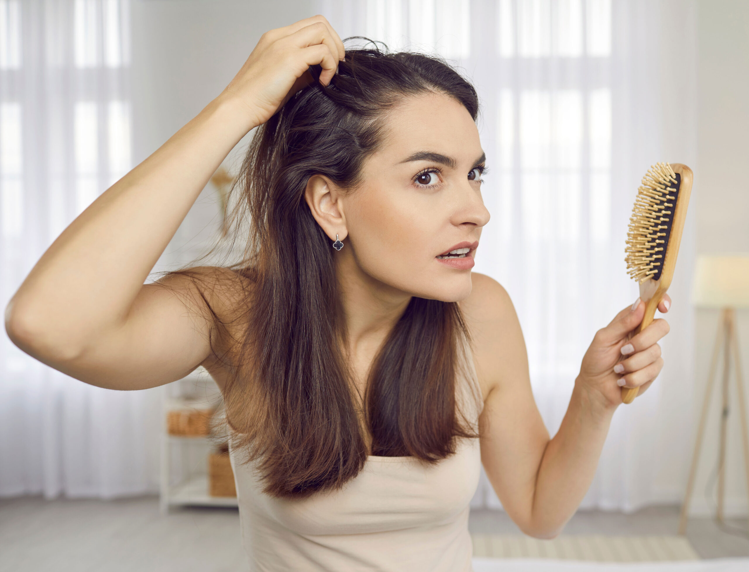 woman-looking-at-scalp-mirror