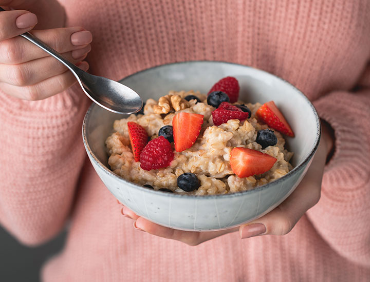 woman-eating-bowl-oatmeal