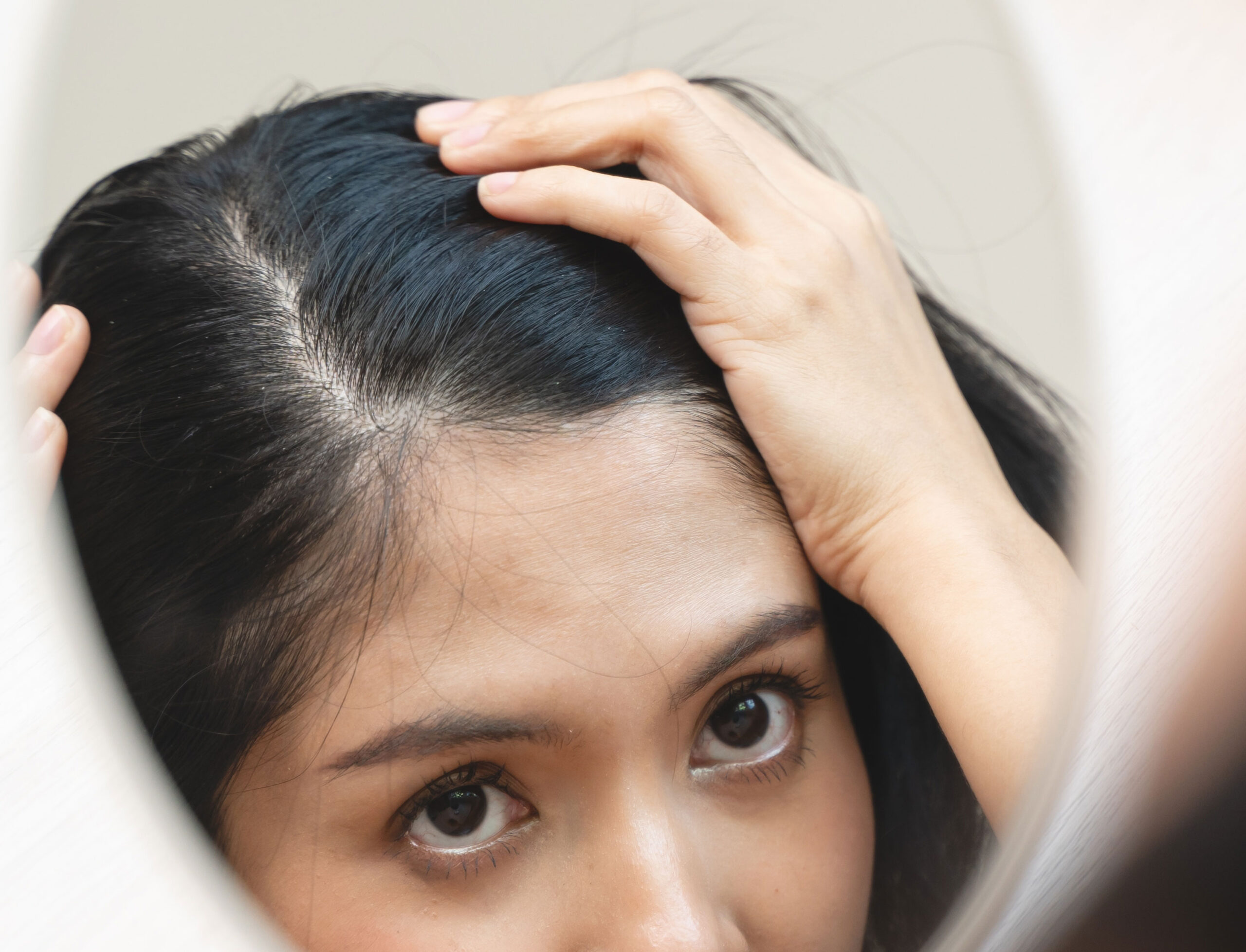 woman-looking-at-mirror