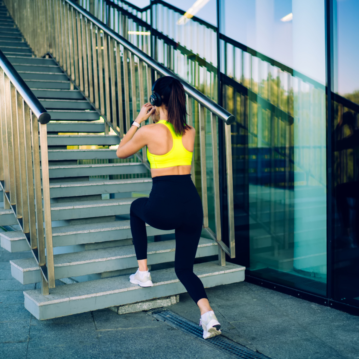 woman exercising on stairs