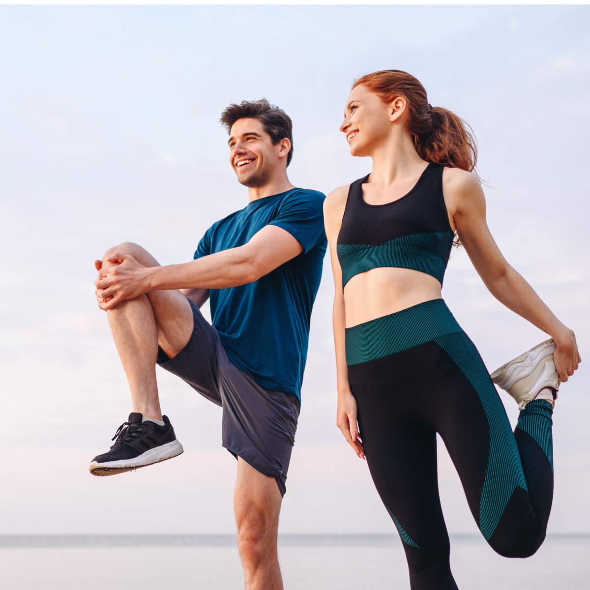 man and woman stretching