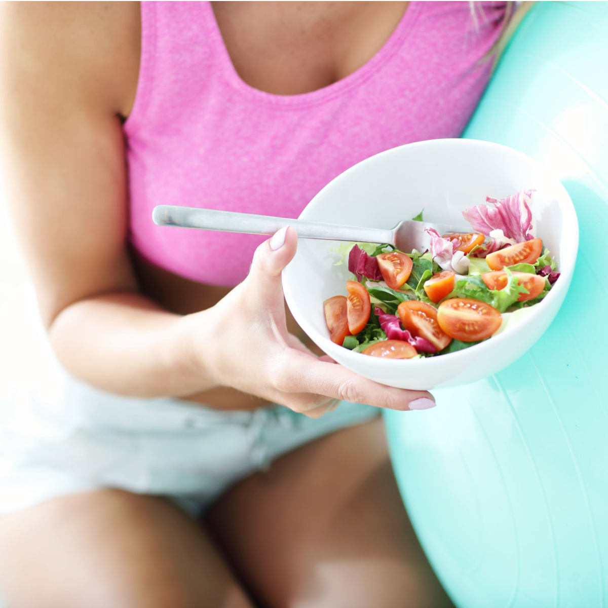 woman eating salad