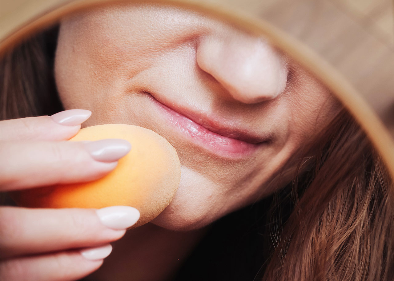 woman-applying-bb-cream