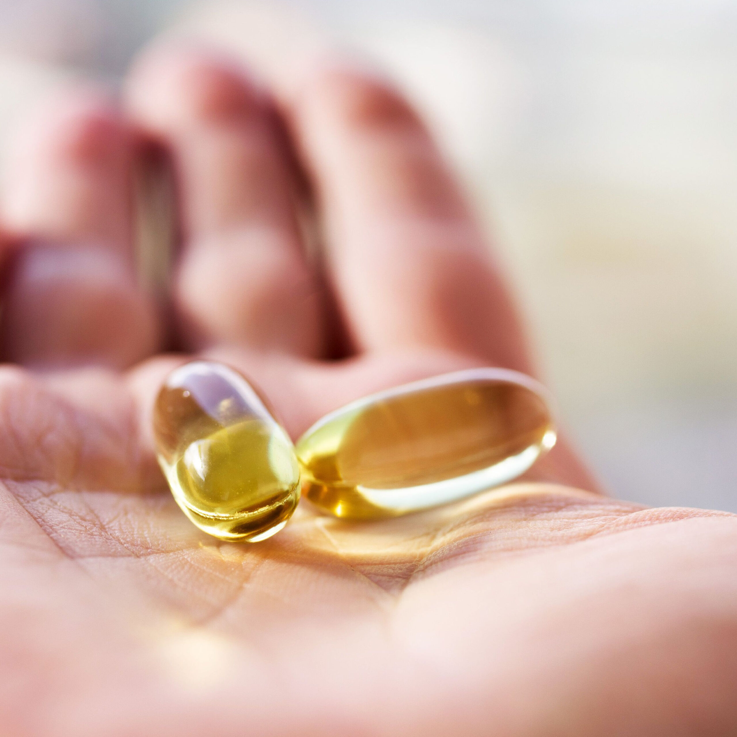 fish oil supplements in hand