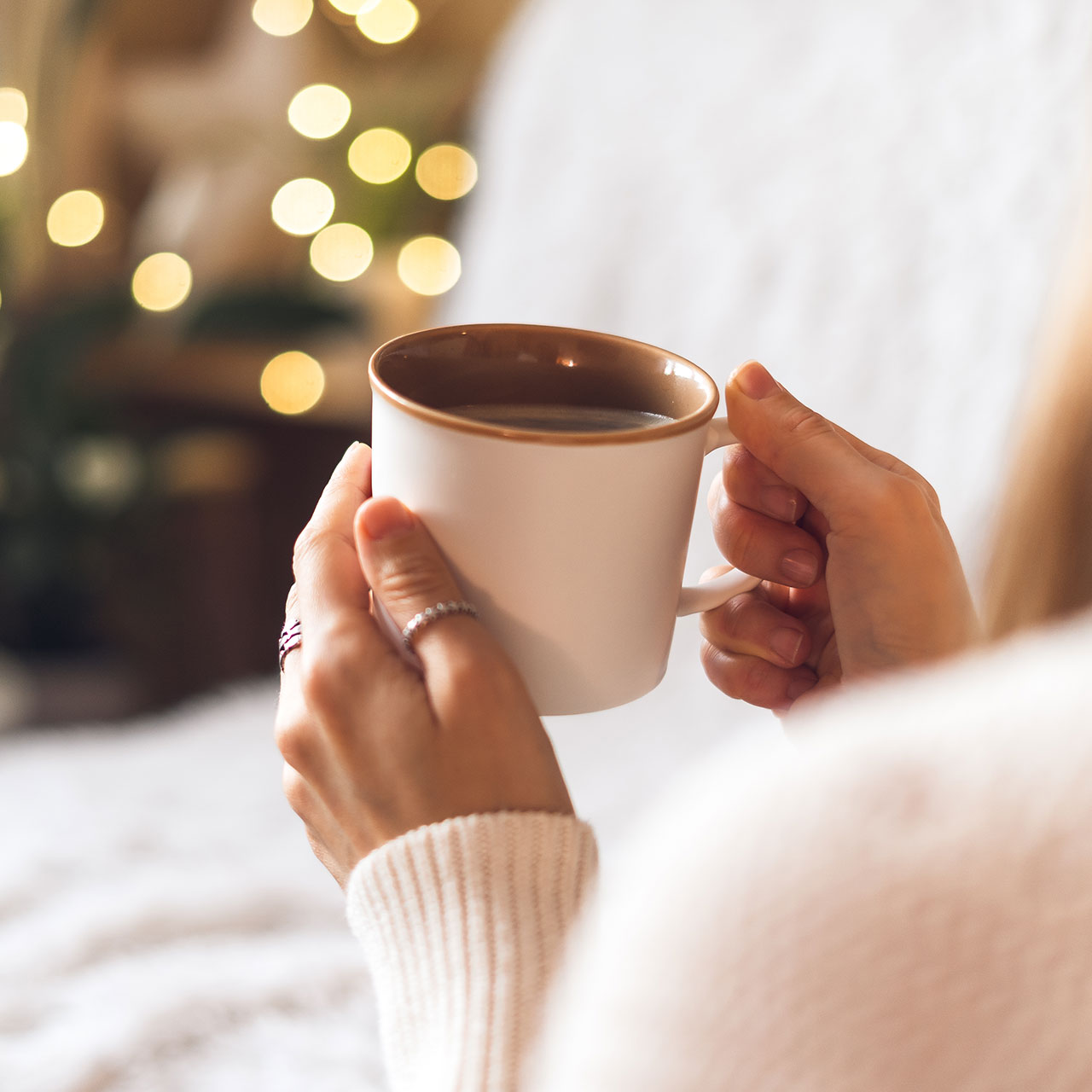 woman drinking cup of coffee