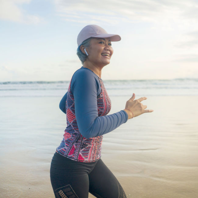 older woman jogging outside