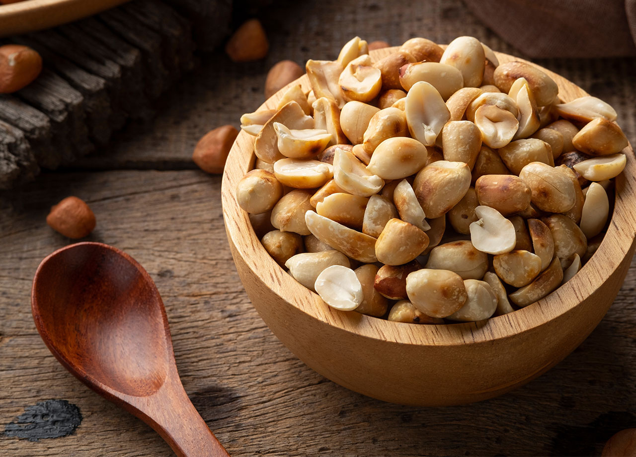 wooden bowl of peanuts