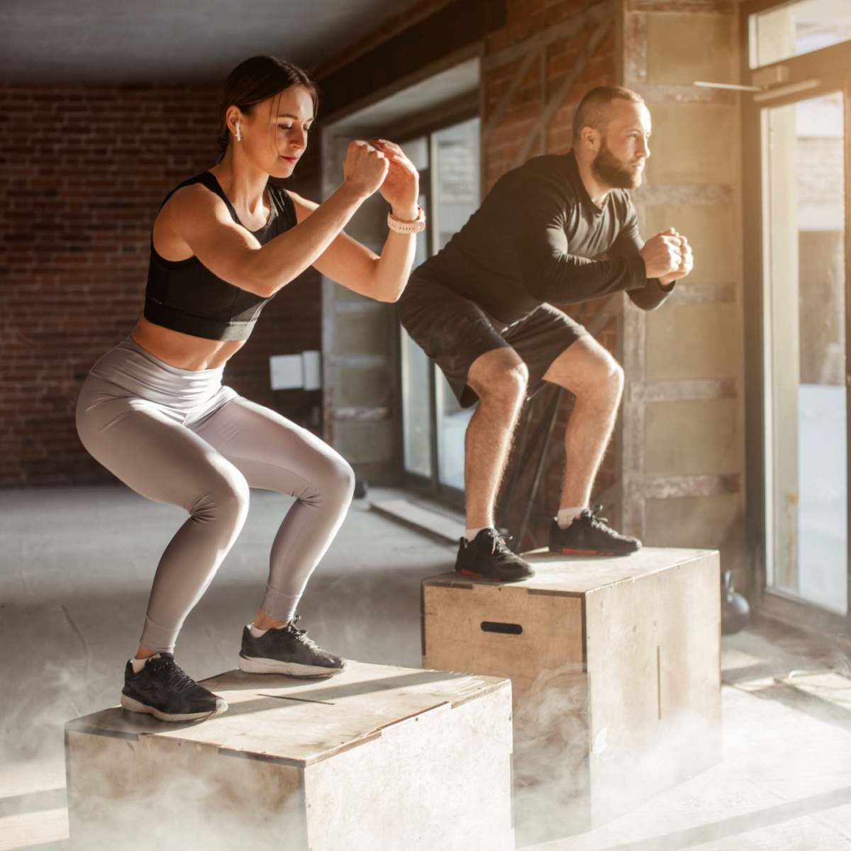 man and woman doing workout