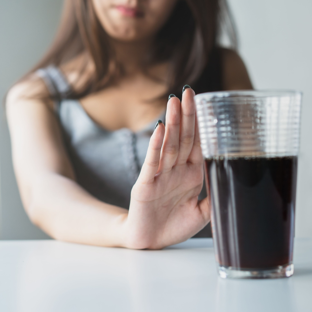 woman refusing soda