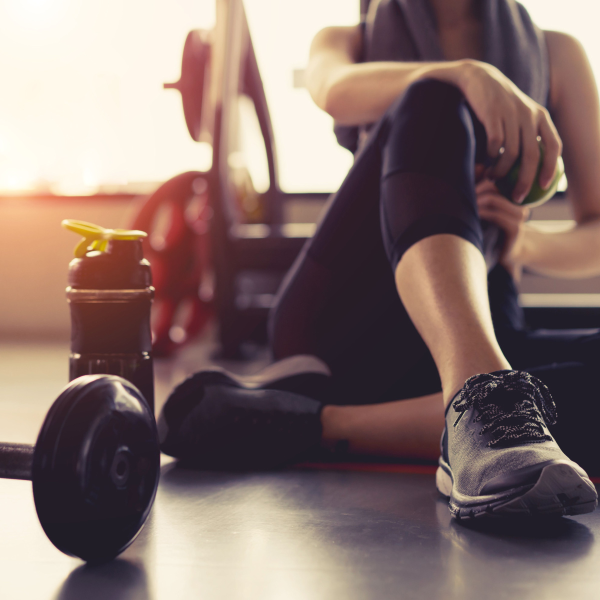 woman sitting down at the gym