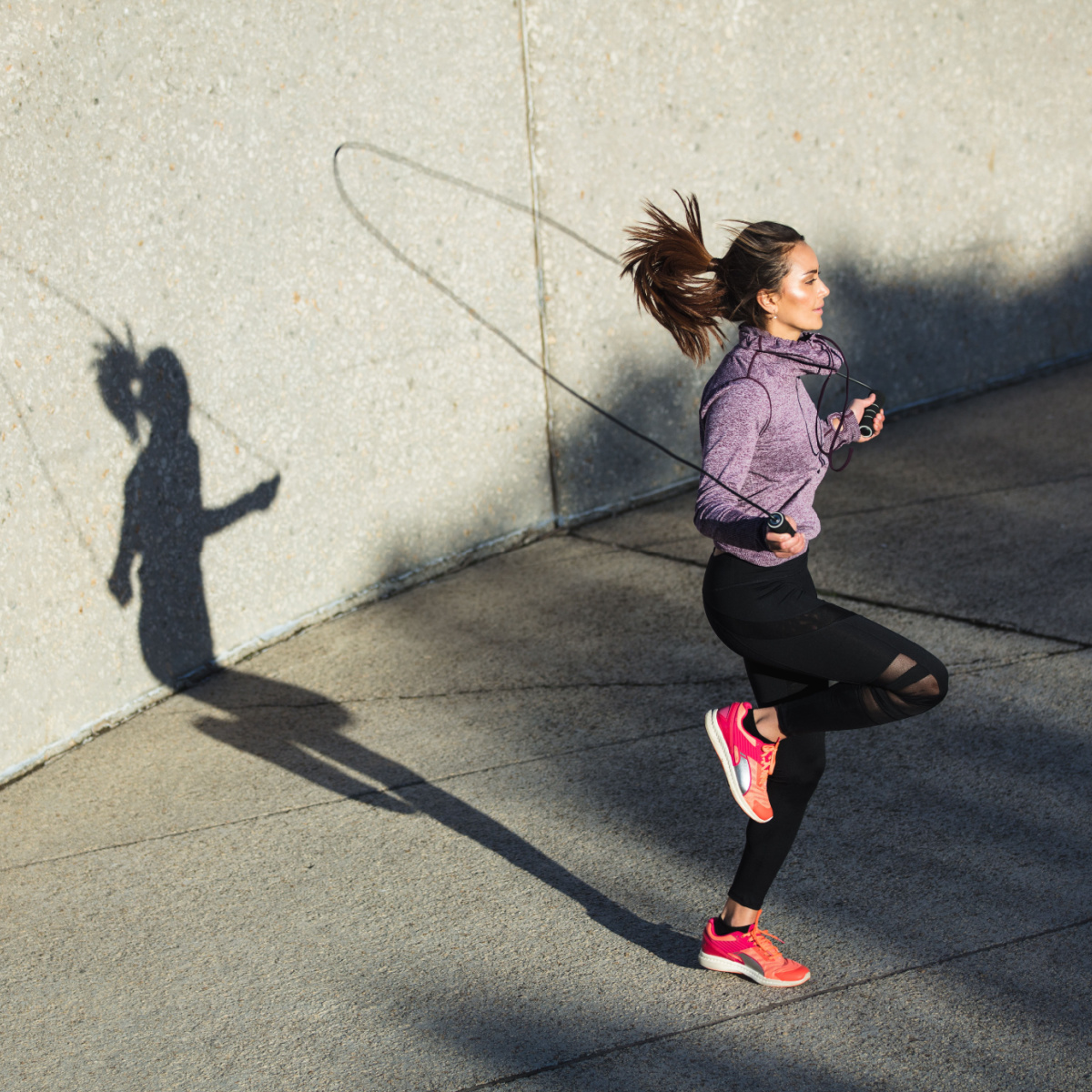 woman doing jump rope