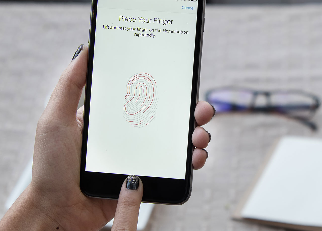 woman-fingerprint-unlock-phone