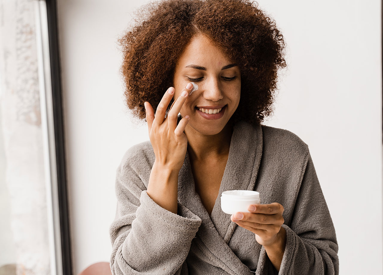 woman-applying-face-cream