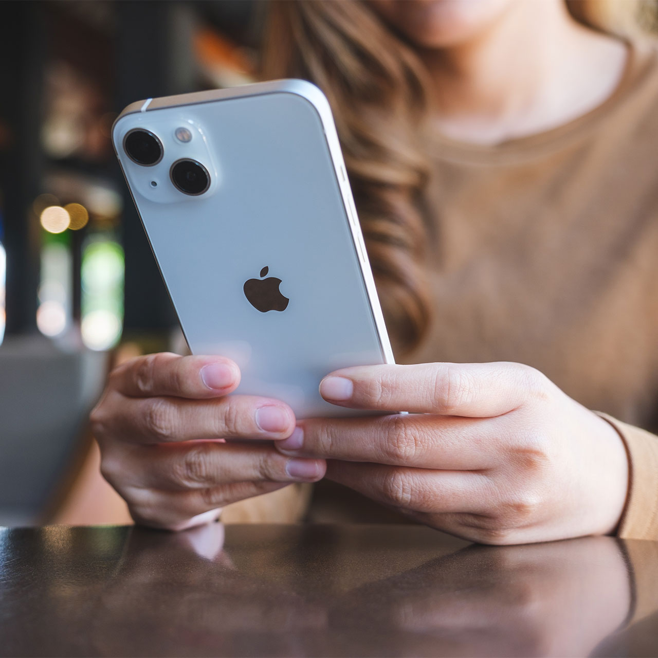 woman-using-white-iphone