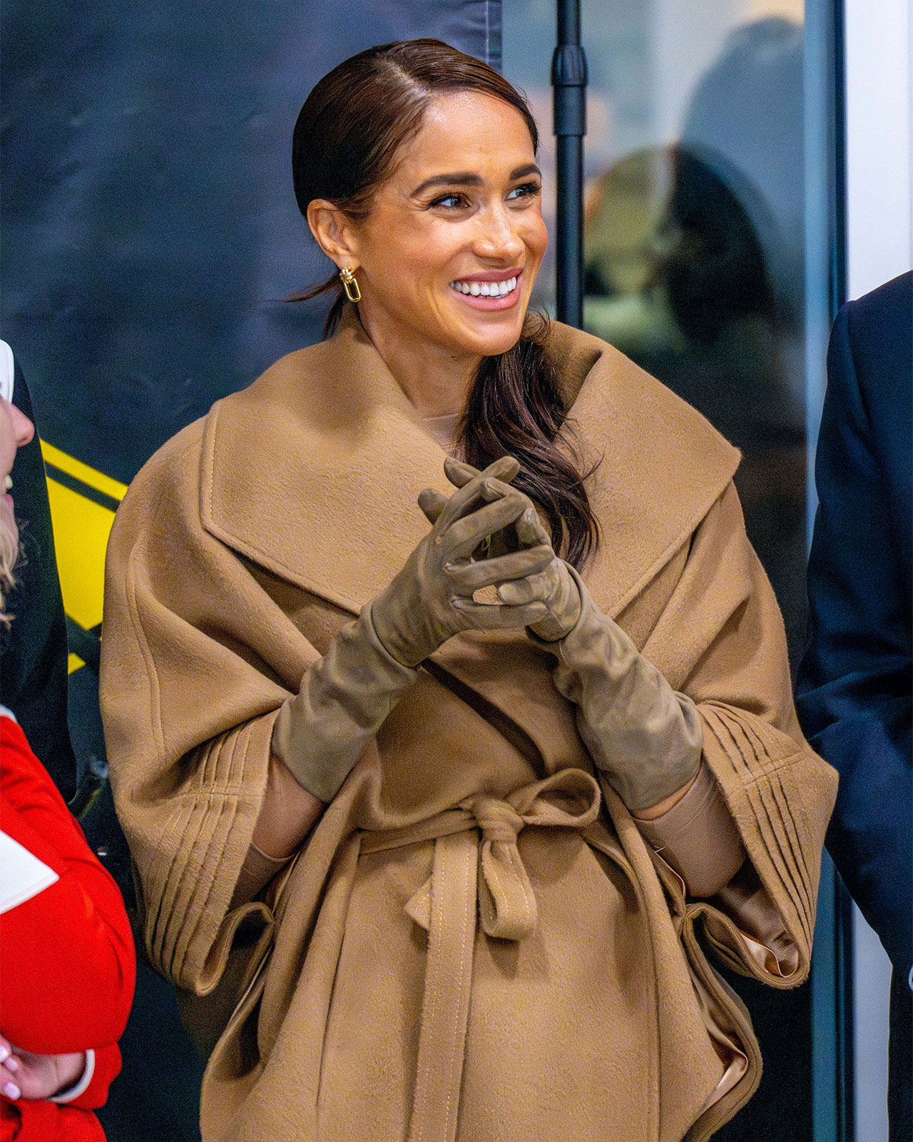 Meghan Markle Invictus Games One Year to Go event Sentaler camel cape smiling