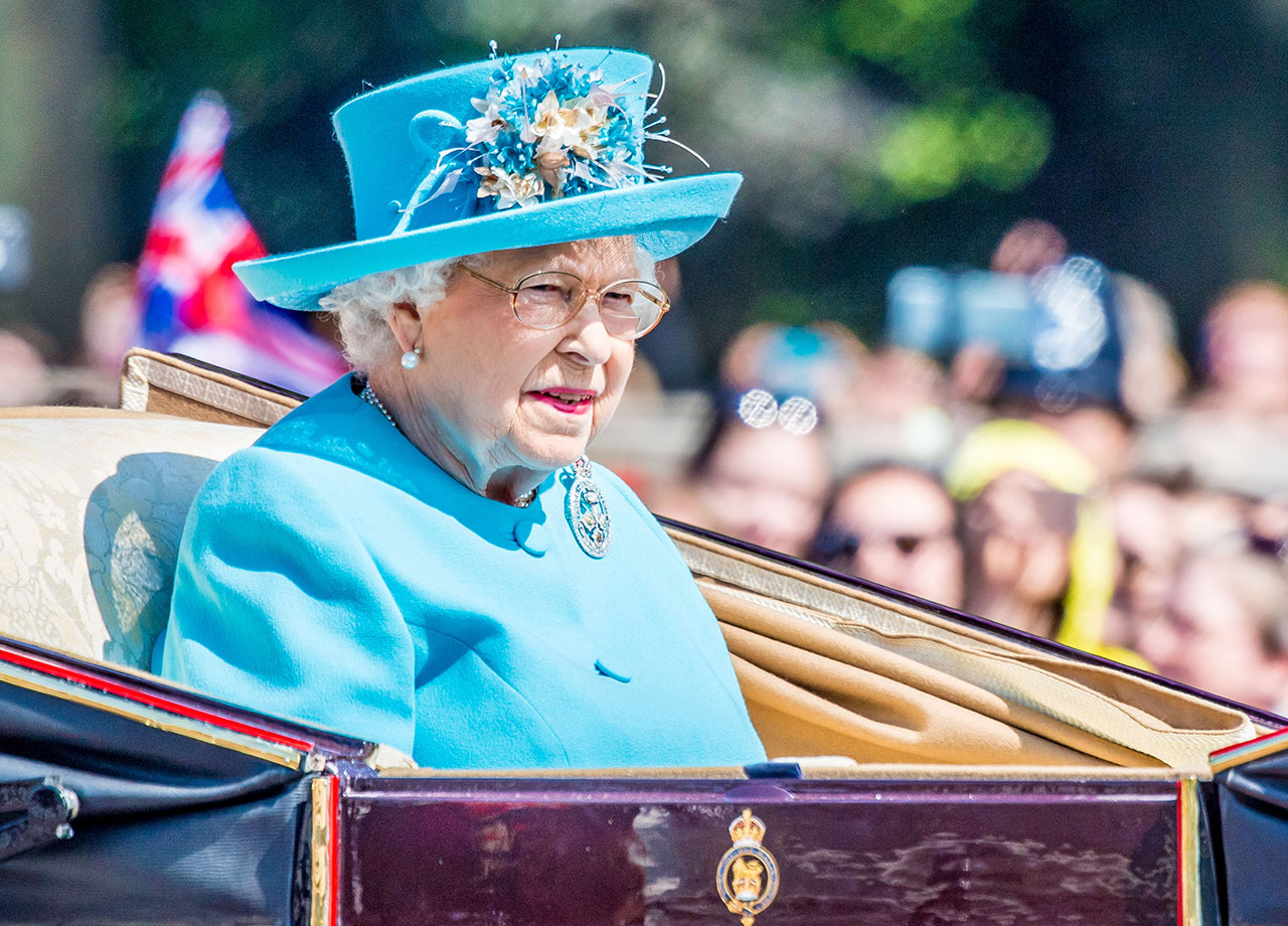 Queen Elizabeth II wearing blue in carriage