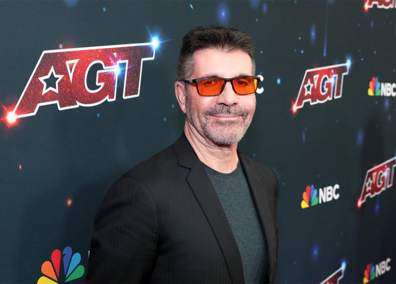 Simon Cowell orange glasses