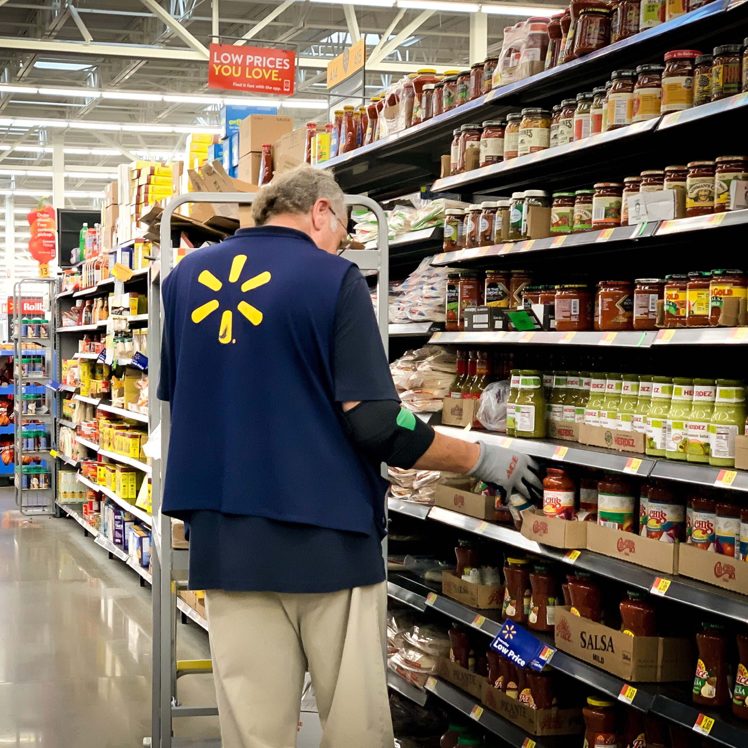 walmart employee stocking shelves