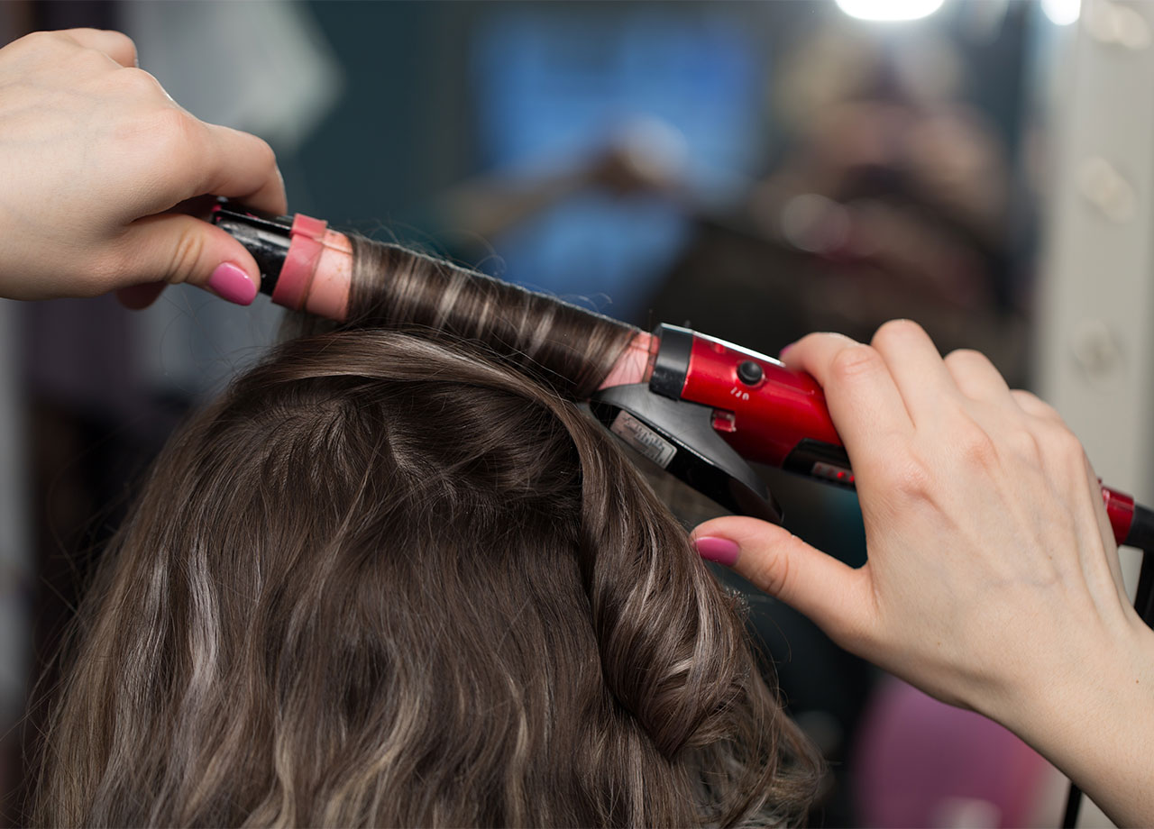 woman-curling-hair