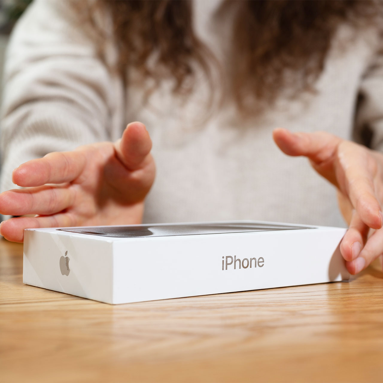 woman-opens-iphone-box
